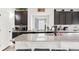 Close up of the kitchen island with a granite countertop and modern faucet fixture at 5318 Truckee St, Denver, CO 80249