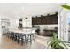 Bright kitchen with a large center island, granite countertops, and stainless steel appliances at 5318 Truckee St, Denver, CO 80249