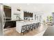 Bright kitchen with a large center island, granite countertops, and stainless steel appliances at 5318 Truckee St, Denver, CO 80249