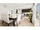 Open-concept kitchen flows into the dining area and features ample cabinet space and sleek appliances at 5318 Truckee St, Denver, CO 80249