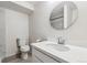 Simple bathroom with a white toilet and a sink at 12863 Crane River Dr, Firestone, CO 80504