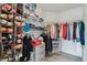 Walk-in closet featuring shelves and rods at 12863 Crane River Dr, Firestone, CO 80504