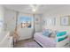 Cozy bedroom with twin daybed and hanging chair at 17826 E 107Th Way, Commerce City, CO 80022