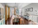 Bright dining area with wood table, bench, and stylish light fixture at 17826 E 107Th Way, Commerce City, CO 80022