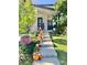 Steps leading to front porch decorated with pumpkins for autumn at 17826 E 107Th Way, Commerce City, CO 80022