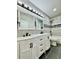 Modern bathroom with double vanity sinks, sleek fixtures, and tiled walls for a luxurious feel at 12213 Joplin St, Commerce City, CO 80603