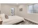 Cozy bedroom featuring a comfortable bed, plush carpet, and a window providing natural light at 12213 Joplin St, Commerce City, CO 80603