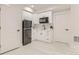 Functional kitchenette with white cabinets, stainless steel appliances, and ample counter space at 12213 Joplin St, Commerce City, CO 80603