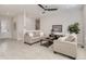 Sunlit living room with neutral tones, comfortable seating, and a ceiling fan at 12213 Joplin St, Commerce City, CO 80603