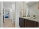 Tasteful bathroom featuring a vessel sink, dark wood cabinets, and sleek fixtures at 236 Back Nine Dr, Castle Pines, CO 80108