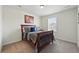 Charming bedroom with a wooden frame bed, neutral carpet, and bright window at 236 Back Nine Dr, Castle Pines, CO 80108