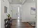 Welcoming foyer with hardwood floors, stylish console table, and modern decor at 236 Back Nine Dr, Castle Pines, CO 80108