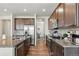 Beautiful kitchen with stainless steel appliances, granite countertops, and hardwood floors at 236 Back Nine Dr, Castle Pines, CO 80108