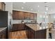 Kitchen with a large island, stainless steel appliances, and hardwood floors at 236 Back Nine Dr, Castle Pines, CO 80108