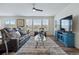 Bright and airy living room with hardwood floors and views of the exterior at 236 Back Nine Dr, Castle Pines, CO 80108