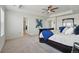 Spacious main bedroom with tray ceiling, ceiling fan and filled with natural light from multiple windows at 236 Back Nine Dr, Castle Pines, CO 80108