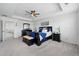 Spacious main bedroom with tray ceiling, ceiling fan and filled with natural light from multiple windows at 236 Back Nine Dr, Castle Pines, CO 80108