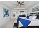 Spacious main bedroom with tray ceiling, ceiling fan and filled with natural light from multiple windows at 236 Back Nine Dr, Castle Pines, CO 80108