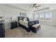 Spacious main bedroom with tray ceiling, ceiling fan and filled with natural light from multiple windows at 236 Back Nine Dr, Castle Pines, CO 80108