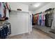 Spacious walk-in closet with ample hanging space and built-in shelving for organization and storage at 236 Back Nine Dr, Castle Pines, CO 80108