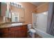 Bright bathroom featuring expansive mirror, cabinet, and modern shower/tub at 1772 Taos St, Brighton, CO 80603