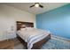 Bedroom with a wood bed frame, an accent wall, and natural light at 1772 Taos St, Brighton, CO 80603