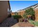 Manicured yard featuring wooden fencing and a tasteful combination of rock beds and plantings for low maintenance at 1772 Taos St, Brighton, CO 80603