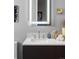 Modern bathroom features a large mirror, sleek countertop and stylish decor at 1919 W 32Nd Ave, Denver, CO 80211