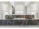 Luxurious bathroom with marble countertops and double sinks and modern fixtures at 1919 W 32Nd Ave, Denver, CO 80211