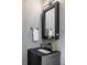 Chic powder room features a modern sink, sleek black counter, and unique decor at 1919 W 32Nd Ave, Denver, CO 80211
