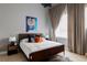 Comfortable bedroom boasts a ceiling fan, wooden floors and a bright window at 1919 W 32Nd Ave, Denver, CO 80211