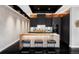 Modern kitchen with sleek cabinets, a stylish island with bar seating, and high-end appliances at 1919 W 32Nd Ave, Denver, CO 80211