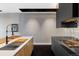 Well-lit modern kitchen with stainless steel appliances, sleek countertops, and stylish fixtures with eat in island at 1919 W 32Nd Ave, Denver, CO 80211