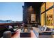 Luxurious rooftop patio with comfortable seating, a modern fire pit, and stylish decor for outdoor entertaining at 1919 W 32Nd Ave, Denver, CO 80211