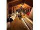 Unfinished attic storage space with exposed wooden beams and cluttered with personal items at 215 Colorado Blvd, Idaho Springs, CO 80452