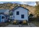 Back exterior view with outdoor seating and space, perfect for relaxing or entertaining at 215 Colorado Blvd, Idaho Springs, CO 80452