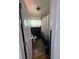 A narrow bathroom including a forest-themed shower curtain and dark accent wall at 215 Colorado Blvd, Idaho Springs, CO 80452