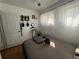 Bright bedroom featuring a ceiling fan, cozy bed, and natural light through sheer curtains at 215 Colorado Blvd, Idaho Springs, CO 80452