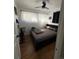 Bright bedroom featuring a ceiling fan, cozy bed, and natural light through sheer curtains at 215 Colorado Blvd, Idaho Springs, CO 80452