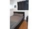 A simple bedroom with a minimalist design, featuring a bed with a headboard and neutral bedding at 215 Colorado Blvd, Idaho Springs, CO 80452