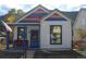 Charming home with colorful accents, inviting front porch, and cozy curb appeal at 215 Colorado Blvd, Idaho Springs, CO 80452