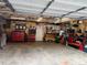 Well-lit two-car garage with organized tool storage and ample workspace for various projects at 215 Colorado Blvd, Idaho Springs, CO 80452