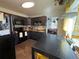 Well-equipped kitchen with black appliances, butcher block counters, and open dining area at 215 Colorado Blvd, Idaho Springs, CO 80452