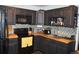 Well-equipped kitchen with black appliances, butcher block counters, and ample cabinet space at 215 Colorado Blvd, Idaho Springs, CO 80452