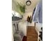 Well-lit laundry room with a washer, dryer, and hanging space, equipped with shelving for easy organization and storage at 215 Colorado Blvd, Idaho Springs, CO 80452