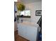 Functional laundry room with a washer, dryer, shelving, and a window for natural light at 215 Colorado Blvd, Idaho Springs, CO 80452