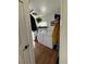 This compact laundry room includes side storage and a modern washer and dryer at 215 Colorado Blvd, Idaho Springs, CO 80452