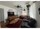 Inviting living room featuring a ceiling fan, large screen television, and comfortable seating at 215 Colorado Blvd, Idaho Springs, CO 80452