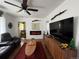 Cozy living room featuring a fireplace, large screen television, and comfortable seating at 215 Colorado Blvd, Idaho Springs, CO 80452
