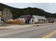 Street view of a home with colorful details near the mountains and a quaint yard at 215 Colorado Blvd, Idaho Springs, CO 80452